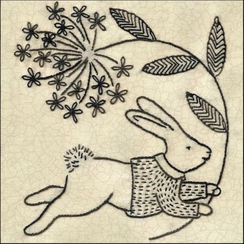 Bunny in a sweater bringing you a flower pattern on Etsy