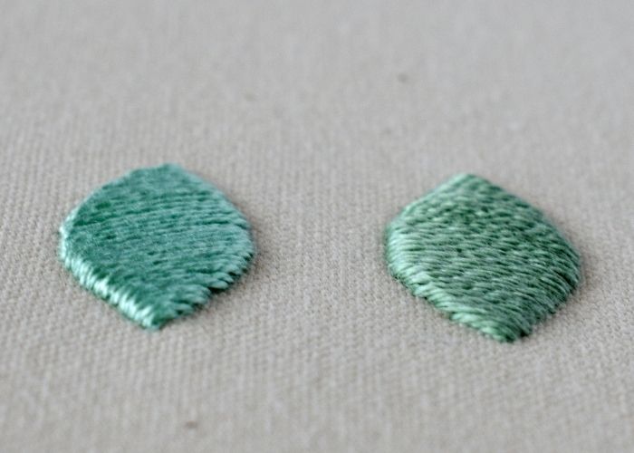 Broderie matelassée au point de satin avec fil de coton perlé vert